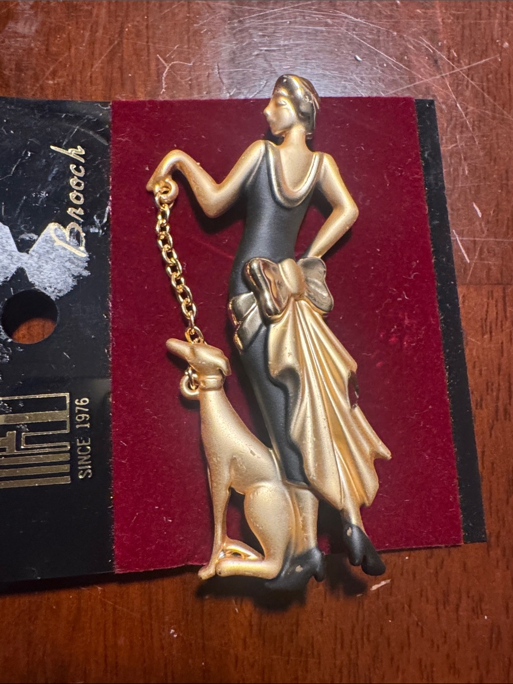 Vintage-Inspired Gold and Black Woman with Greyhound Brooch
